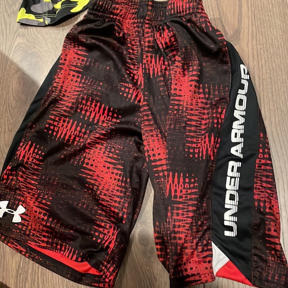 two basketball shorts both red are mediums and camp is large - Picture 2 of 4